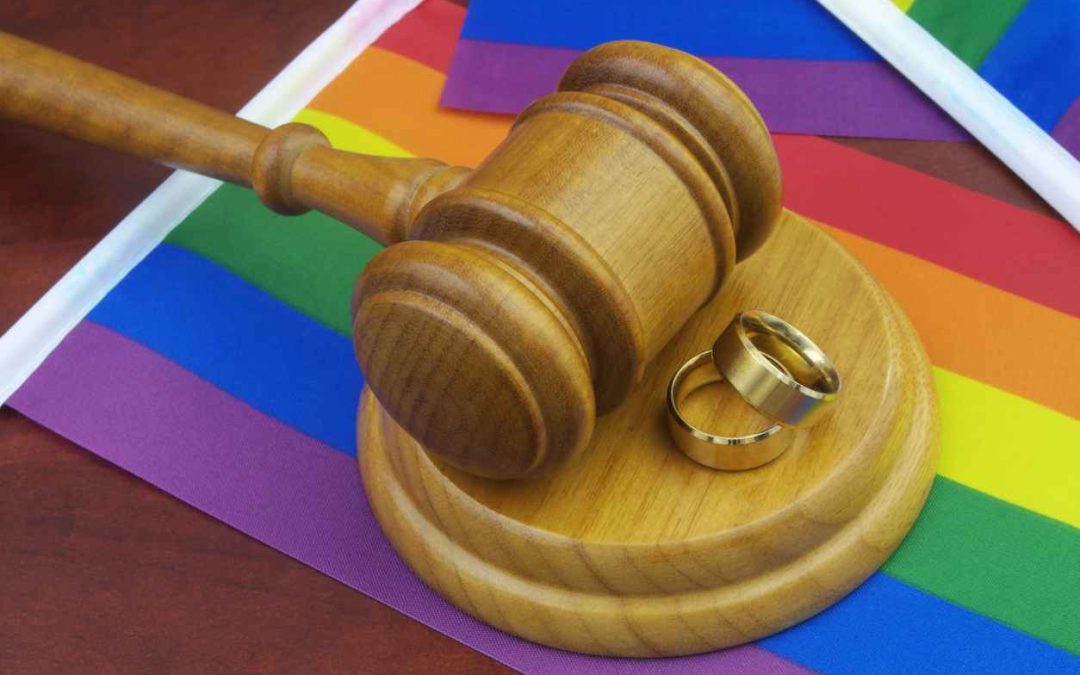 Wedding rings, wooden gavel and LGBT flags; marriage equality in the U.S.